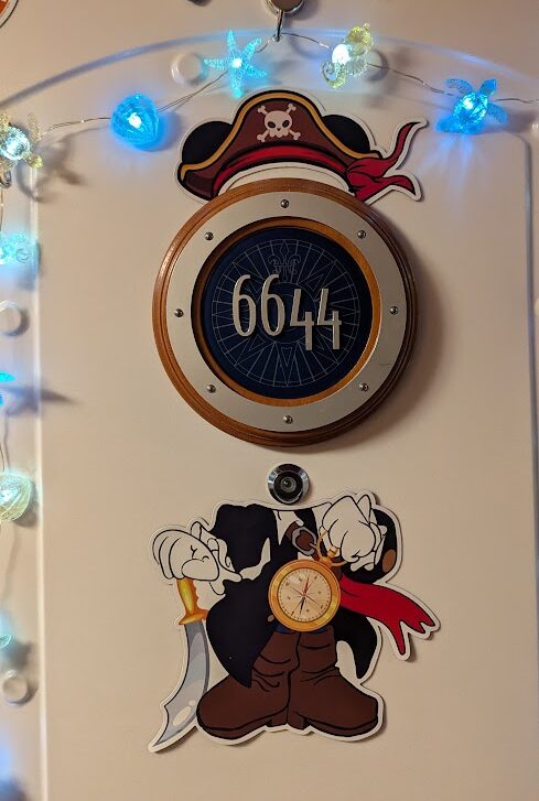 Image of a beautifully decorated Disney Cruise stateroom door, showing magnets neatly contained within the door boundaries